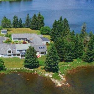 The inn sits at the end of a peninsula. It is surrounded by water on three sides.