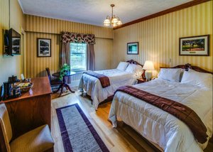 The Shawnee Inn and Golf Resort in Shawnee on Delaware, image may contain: Dorm Room, Bed, Home Decor, Chair