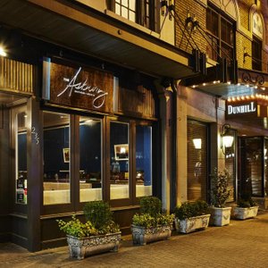 The Dunhill Hotel in Charlotte, image may contain: Home Decor, Living Room, Couch, Table