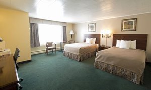 Travelers Inn in Brunswick, image may contain: Dorm Room, Furniture, Hotel, Chair