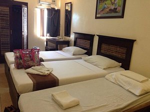 Darunday Manor in Bohol Island, image may contain: Bed, Furniture, Handbag, Hotel