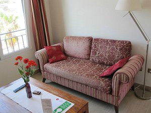 Atrium Hotel & Restaurant in Mazarron, image may contain: Couch, Furniture, Lamp, Cushion
