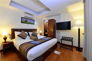 Cherry Hills Hotel in Yangon (Rangoon), image may contain: Monitor, Screen, Computer Hardware, TV