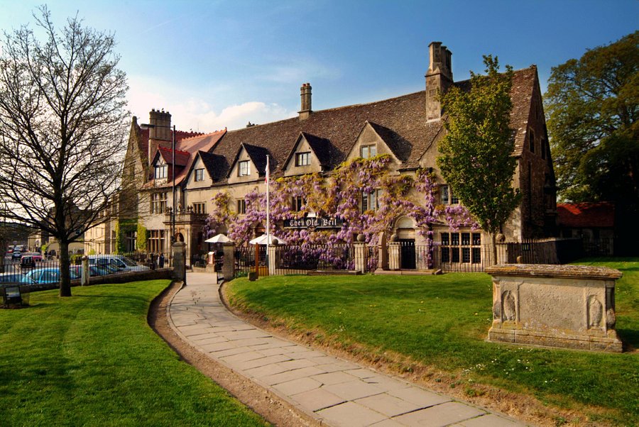  The image shows the front of a 13th century coaching inn, The Old Bell Hotel, located in the market town of Malmesbury, beside the Abbey.