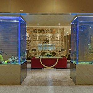 Niranta Airport Transit Hotel & Lounge in Mumbai, image may contain: Floor, Flooring, Indoors, Foyer
