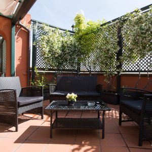 Fiume Hotel in Rome, image may contain: Couch, Living Room, Coffee Table, Table