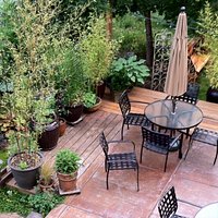 Patio dining surrounded by gardens
