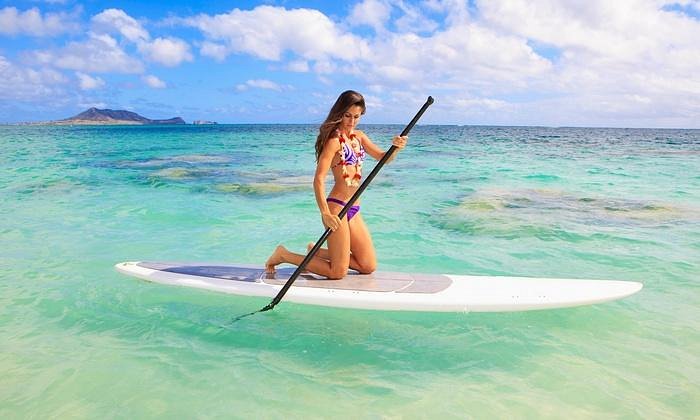 girl paddleboarding in miami