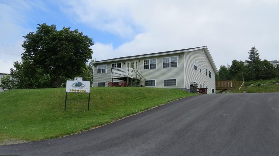 Witless Bay Suites. Room 1A is the one to the right of the entrance on upper floor.