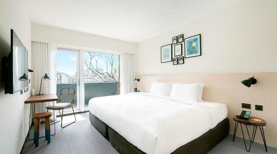 Balcony King Room with a private terrace for relaxing and floor-to-ceiling windows