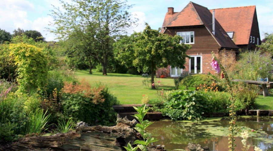 a pretty photo from the rear of the cottage from the pond