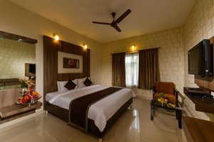 Hotel Sanman Gardenia in Bengaluru, image may contain: Monitor, Screen, Computer Hardware, Ceiling Fan