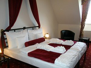 Hotel Grand Vígľaš in Viglas, image may contain: Bed, Furniture, Chair, Bedroom