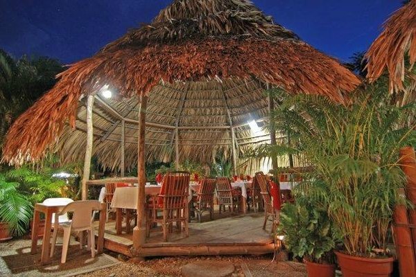 Dining at Kariwak Village in our open air restaurant