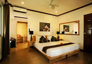 Buena Vida Resort and Spa in Cebu Island, image may contain: Corner, Ceiling Fan, Bed, Interior Design