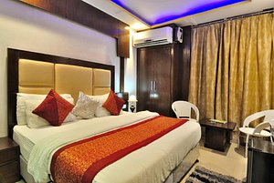 Hotel Shelton in New Delhi, image may contain: Resort, Hotel, Bed, Chair