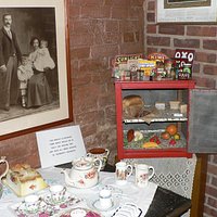 A kitchen setting with old larder in corner