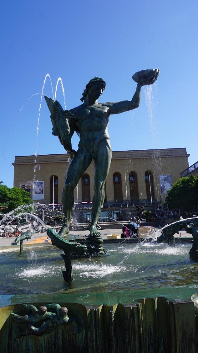 The iconic Poseidon statue fountain in Götaplatsen, Gothenburg's main cultural square, with the Gothenburg Art Museum and Concert Hall visible in the background.