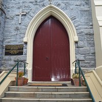 Church door and history plaque