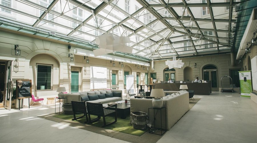 Glass enclosed lobby to enjoy sunshine while reading complimentary international newspapers