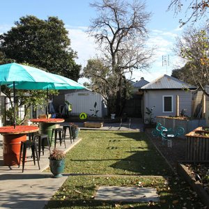 Wonderful outdoor entertaining with kids play equipment and chooks