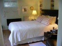 cozy and clean queen bed with fireplace for chilly eves