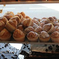 A variety of scrummy magdalenas in the window