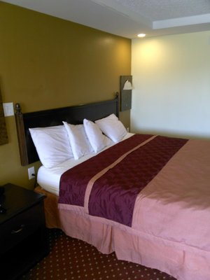 Knights Inn Saginaw in Saginaw, image may contain: Bed, Furniture, Cushion, Bedroom
