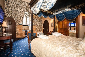 Langley Castle Hotel in Langley-on-Tyne, image may contain: Furniture, Bedroom, Indoors, Bed