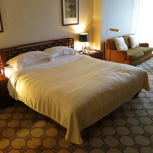 Grand Hotel Beijing in Beijing, image may contain: Bed, Furniture, Bedroom, Indoors