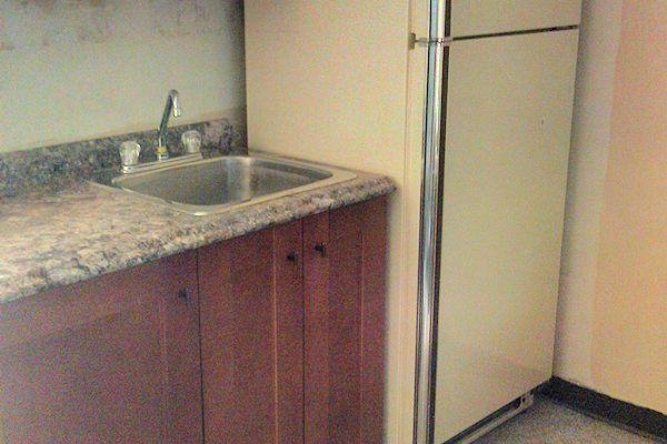 Lack of attention to detail - under the counter, beside the fridge, under the cupboards