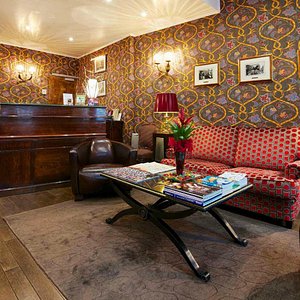 Relais Hotel du Vieux Paris in Paris, image may contain: Home Decor, Living Room, Interior Design, Couch