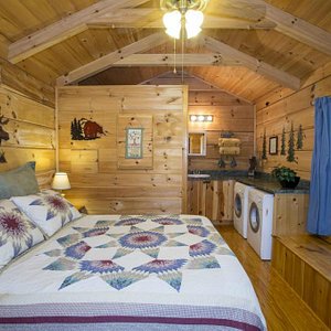 One room log cabin with pocket doors.
