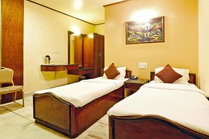 Zo Shivam, Railway Station in Pune, image may contain: Hotel, Bed, Chair, Resort
