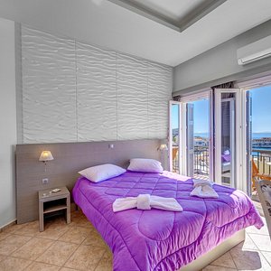 Hotel Ethrion in Syros, image may contain: Penthouse, Balcony, Bed, Lamp