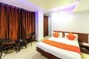 The Signature Inn in Bengaluru, image may contain: Hotel, Resort, Bed, Furniture