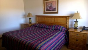 Stonecrest Motel in Piedmont, image may contain: Lamp, Furniture, Table Lamp, Bed