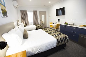 Altitude Motel Apartments in Toowoomba, image may contain: Monitor, Screen, Furniture, Bed