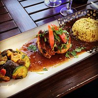 Curried vegetables, seared duck, and couscous