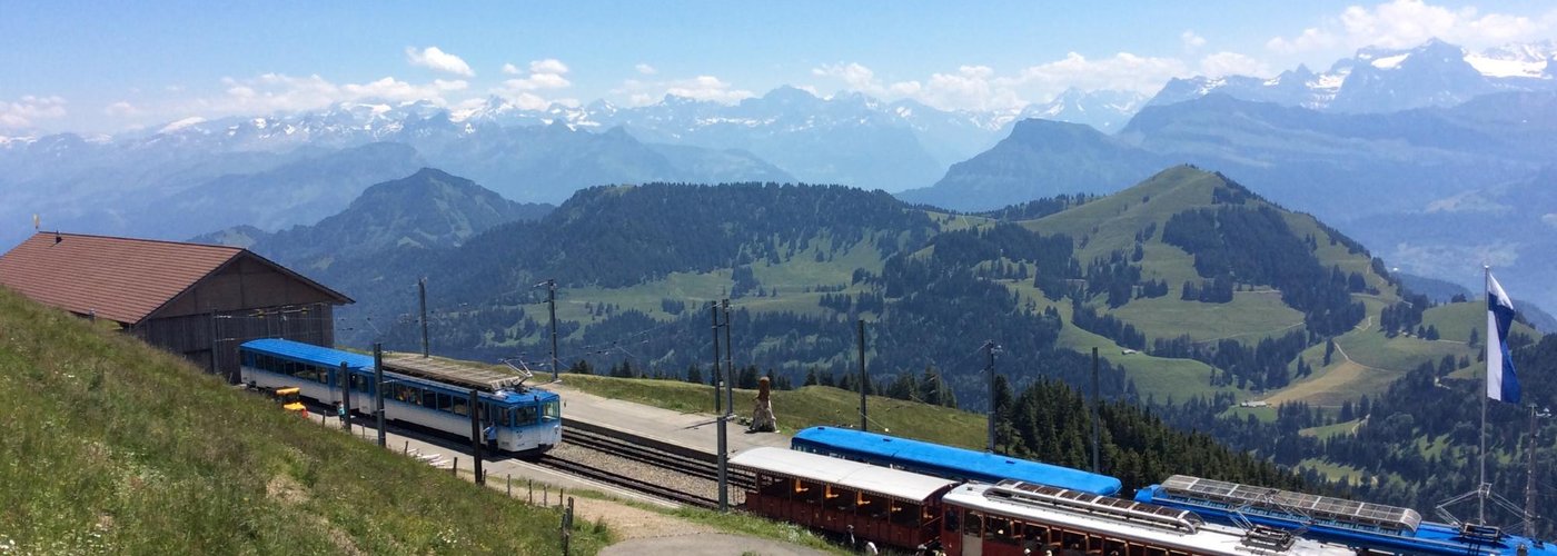 View from Rigi to unique Rigi Bahn and the snowy Alps