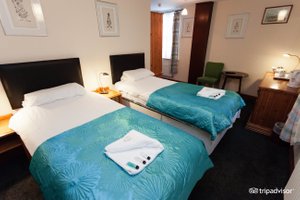 The George Hotel in Portsmouth, image may contain: Chair, Furniture, Bed, Bedroom