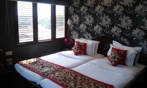 A Palace on the River, Rashmi Guest House in Varanasi, image may contain: Cushion, Home Decor, Bed, Furniture