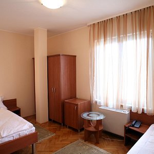 Garni Hotel Andjelika in Kragujevac, image may contain: Bed, Furniture, Bedroom, Indoors