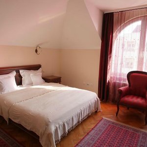 Garni Hotel Andjelika in Kragujevac, image may contain: Bed, Furniture, Bedroom, Indoors