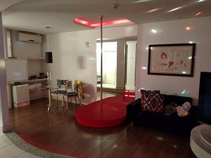 Nantai Motel in Florianopolis, image may contain: Living Room, Couch, Flooring, Lighting