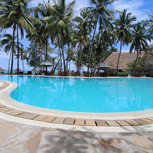 Diani Sea Lodge in Diani Beach, image may contain: Hotel, Resort, Pool, Outdoors