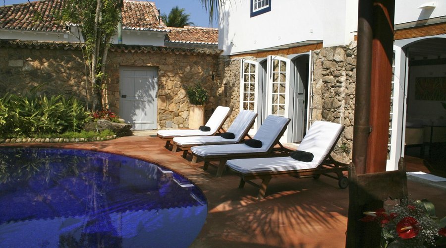Loungers by the pool in the walled garden