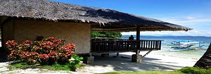 Blue Cove Island Resort in Palawan Island, image may contain: Shelter, Waterfront, Hut, Villa