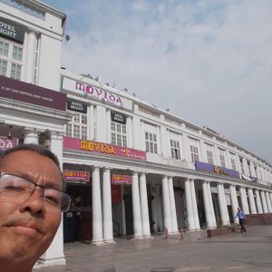 At the area of the very big circular-shaped Connaught Place about a half-hour walk from the Inn