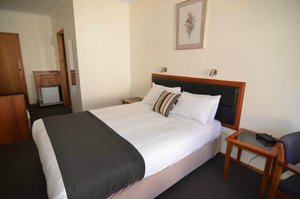 Argyle Motor Lodge in Hobart, image may contain: Cushion, Bed, Furniture, Dorm Room